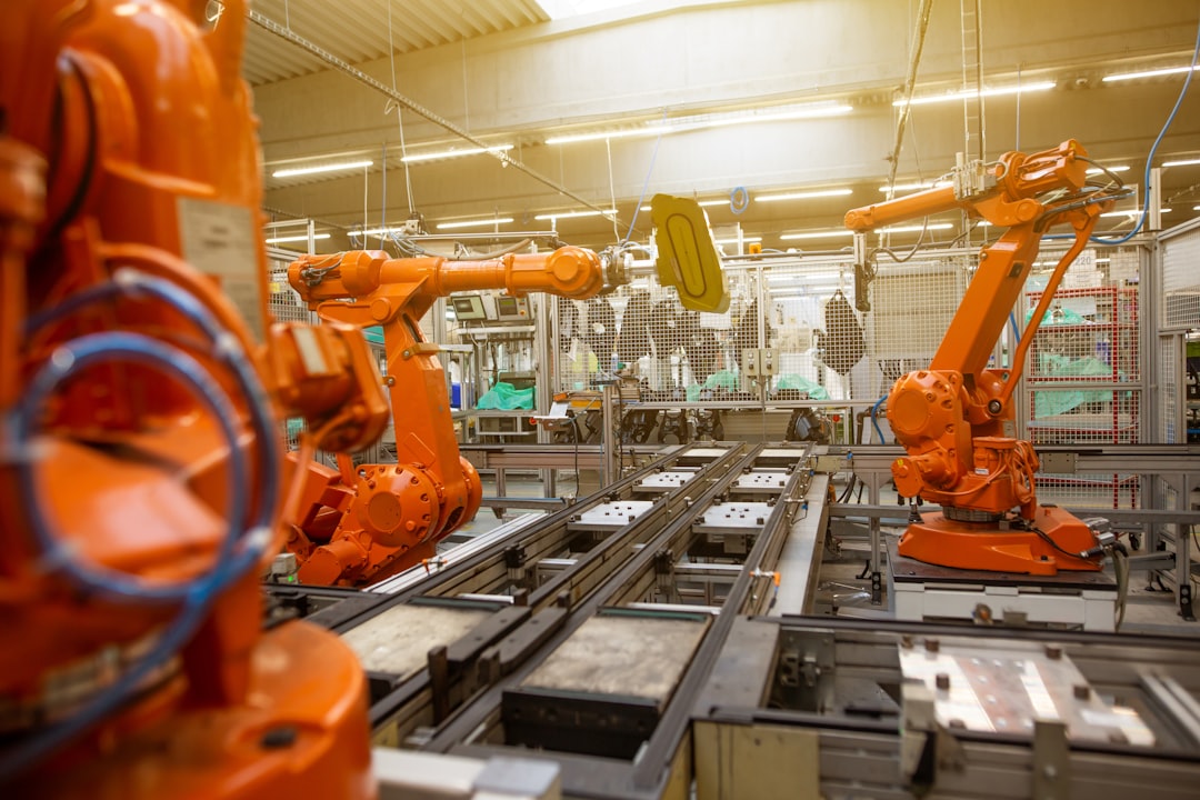 【n8n】バージョン 2025-06-03 リリース！安定性向上でワークフローを強化【2025年最新】 - Automatic robots in the industrial factory for assembly automotive products, automotive concept