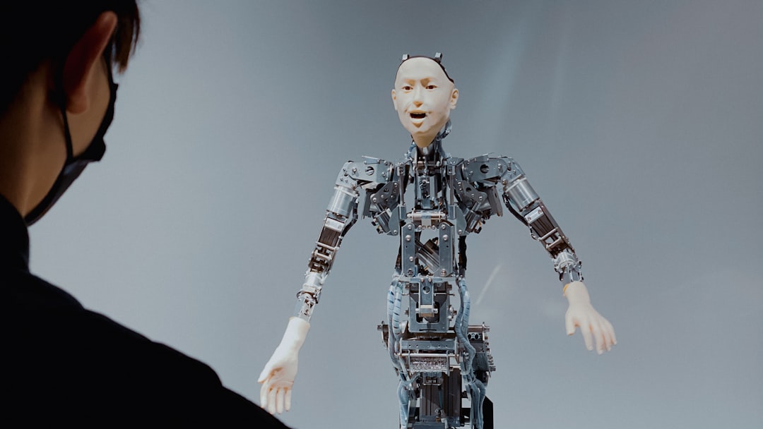 【Gemini】2025.12.17リリース!Gemini 3 Flashがデフォルトに - a woman looking at a robot in the air