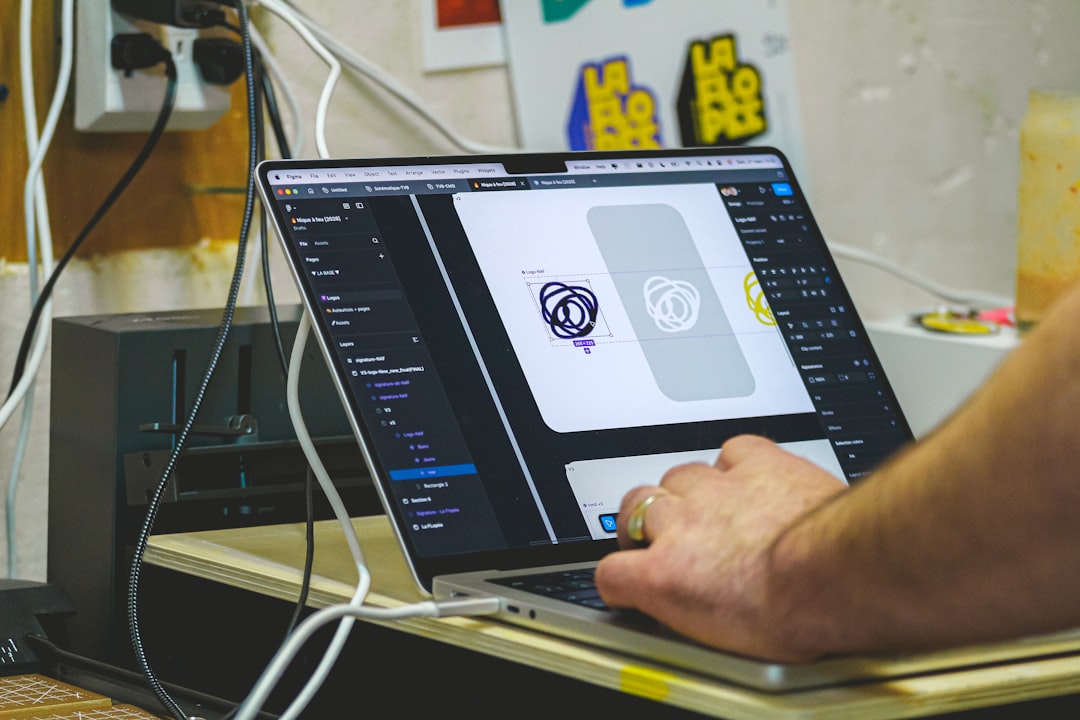 Claude Design徹底解説：デザイン未経験者がAIでアプリ試作を爆速化する方法 - Person designing on a laptop computer screen.