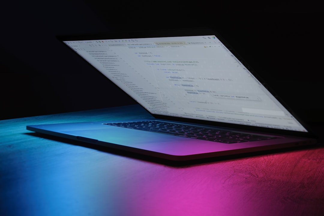 【Devin】April 22, 2026アップデート！PR管理とエンタープライズ機能が大幅強化 - Open laptop with code on screen, neon lighting