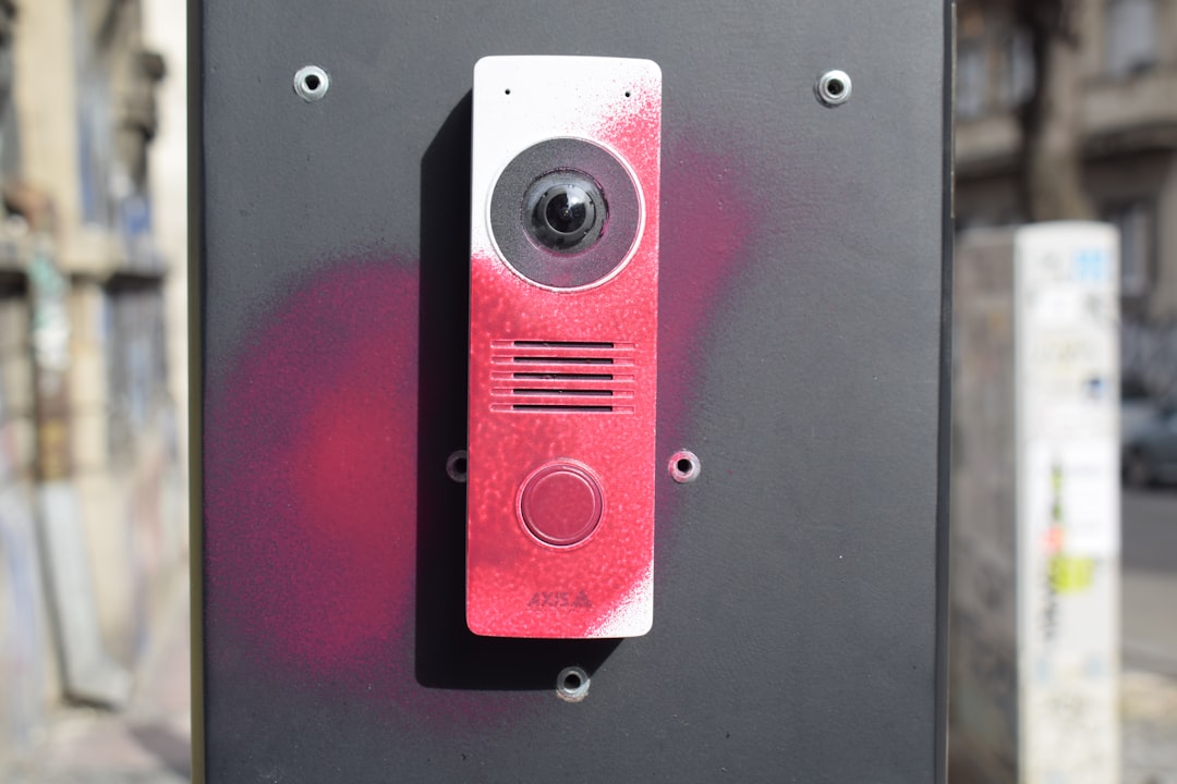 RingのAI対応ドアベルが進化：Alexa活用で訪問者対応を自動化する未来 - Intercom device with red spray paint markings