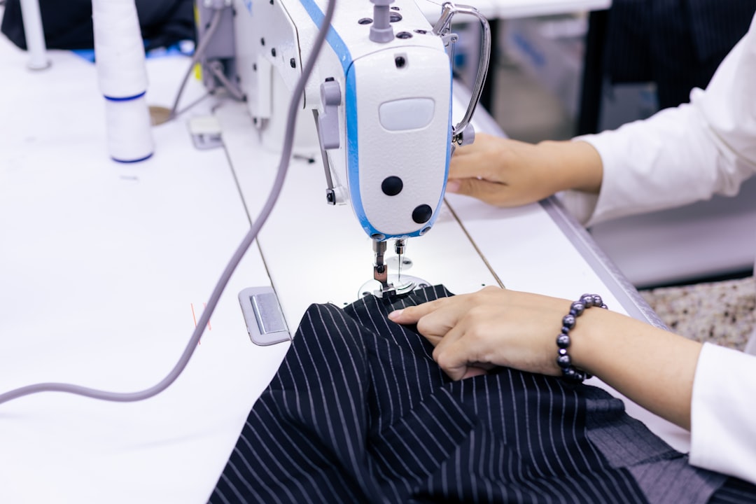 ファッション業界のAI革命：Fynd Createが変えるサプライチェーンの未来 - a woman using a sewing machine to sew clothes